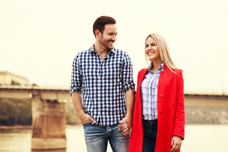 Young happy couple is enjoying city.の写真素材