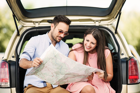 Happy couple looking at map.