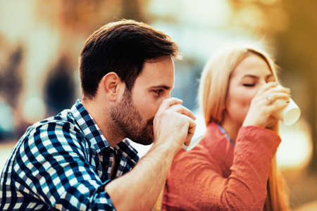 Young happy couple is enjoying in the park.の写真素材