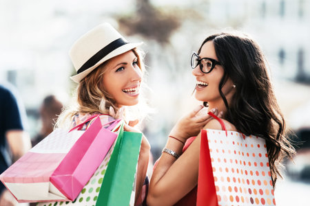 Young and attractive women enjoying shopping.