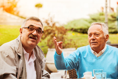 Senior friends enjoying city early in the morning.の写真素材