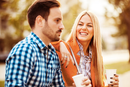 Young happy couple is enjoying city.