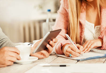 Young business people having meeting in restaurant early in the morning.の写真素材