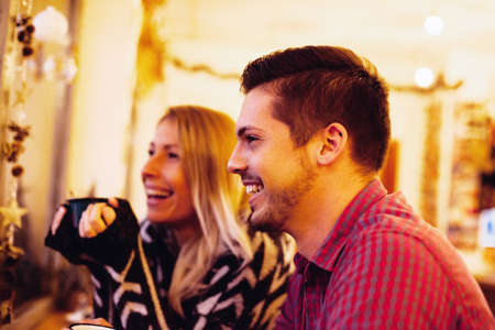 Young couple enjoying coffee shop.の写真素材