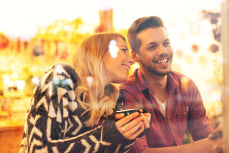 Young couple enjoying coffee shop.の写真素材