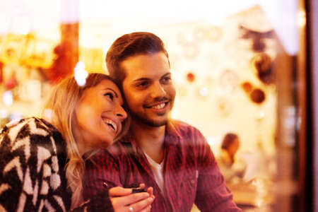 Young couple enjoying coffee shop.の写真素材