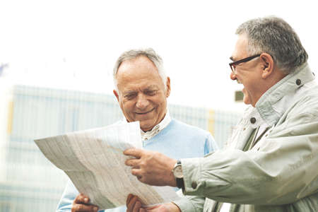 Senior tourists enjoying city early in the morning.の写真素材