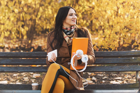 Young woman in the park using cellphone.