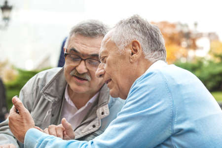 Senior friends enjoying city early in the morning.の写真素材