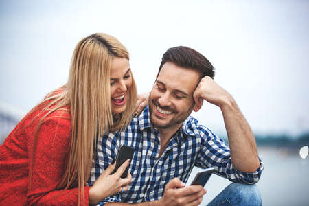 Young happy couple is enjoying outside.の写真素材