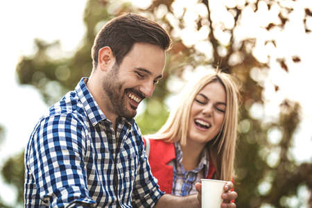 Young happy couple is enjoying outside.の写真素材