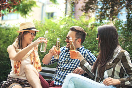 Group of young people having fun in the park.の写真素材