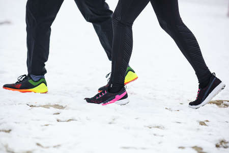 Couple running outdoors.  Close up concept.の写真素材