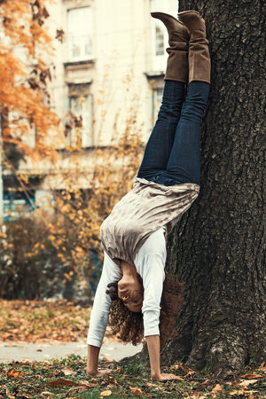 Beautiful young woman relaxing with yoga outdoors.の写真素材