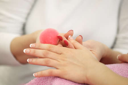 Enjoying manicure in salon.の写真素材