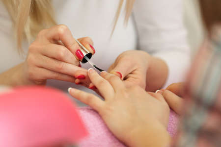 Well manicured nails. Selective focus on beautician point finger.の写真素材