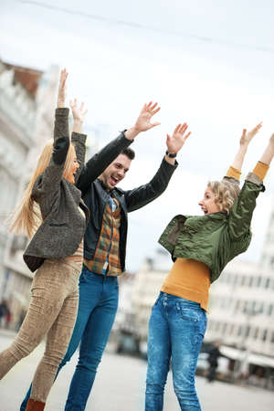 Group of young people having fun in the city.の写真素材