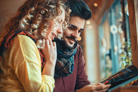 Young couple enjoying restaurant.の写真素材