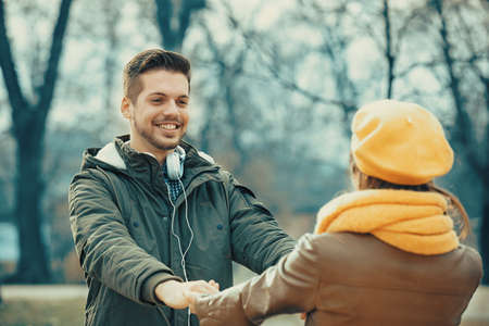 Young and attractive couple enjoying in the park.の写真素材