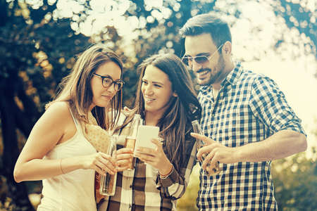 Group of young people having fun in the park.の写真素材