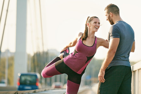 Happy couple exercising outdoors. Living healthy lifestyle.