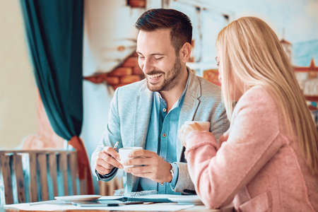 Young business people having meeting is restaurant early in the morning.の写真素材