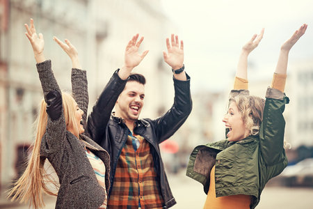 Group of young people having fun in the city.