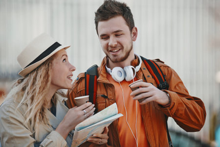 Couple tourist walking in downtown and looking at city map.