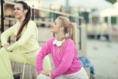 Sportive young woman exercising outdoors. Lilving healthy lifestyle.の写真素材
