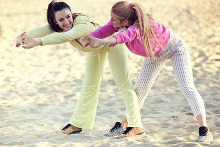Sportive young woman exercising outdoors. Lilving healthy lifestyle.の写真素材