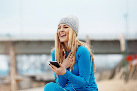 Young blonde woman is jogging early in the morning.