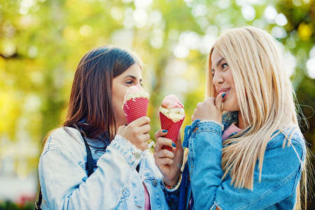 Happy young women having fun in the city.の写真素材