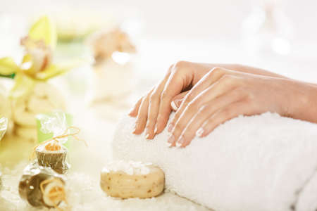 Spa concept. Young woman's arms and hands in the spa. の写真素材