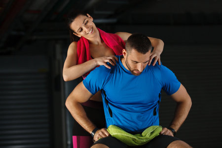 Young couple relaxing after training. Living healthy lifestyle.