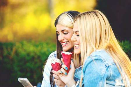 Happy young women having fun in the city.の写真素材