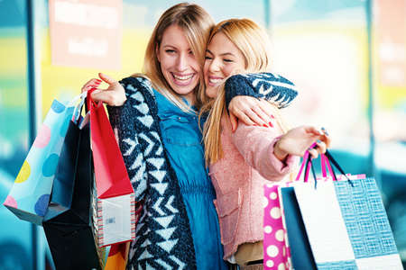 Young and attractive young woman enjoying shopping.の写真素材