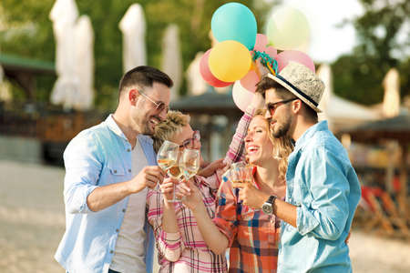A group of friends having great time together on the beach.の写真素材