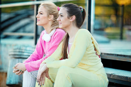 Sportive young woman relaxing after exercising outdoors. Living healthy lifestyle.の写真素材