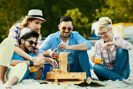 A group of friends having great time together on the beach.の写真素材