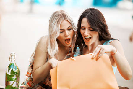 Young and attractive women are enjoying shopping.の写真素材