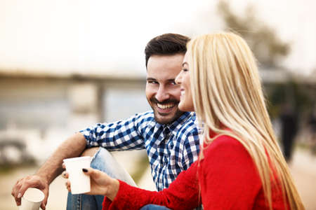 Young happy and attractive couple is enjoying outside.の写真素材