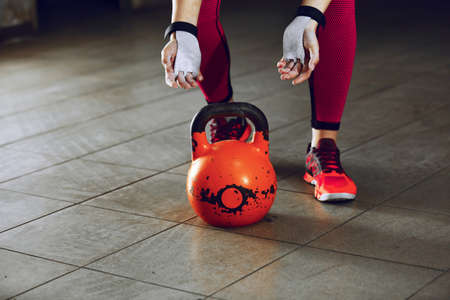 Young athlete woman is training with kettlebell.の写真素材