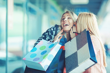 Beautiful young woman enjoying autumn shopping.の写真素材