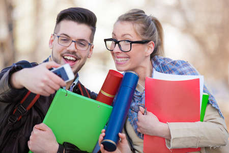 College students took their diplomas and taking photo.の写真素材