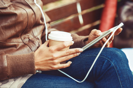Beautiful woman enjoying autumn day in the park.の写真素材