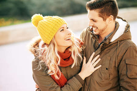 Young smiling couple is enjoying city in the morning.の写真素材