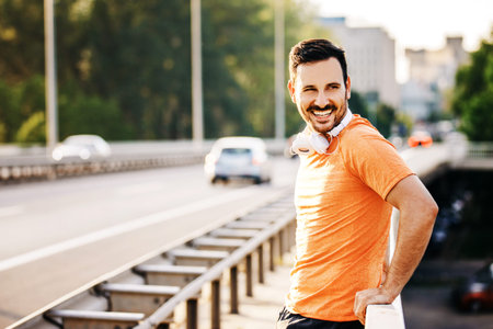 Young handsome man is exercise on the bridge.の写真素材