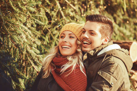 Young couple in love celebrating Christmas in downtown.の写真素材