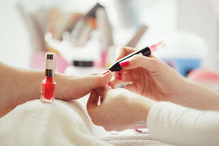 Woman feet receiving pedicure. Close up concept. の写真素材