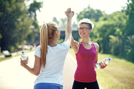 Two young woman is exercising in the morning.の写真素材